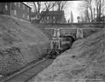 A locomotive exiting the northern end of the tunnel 